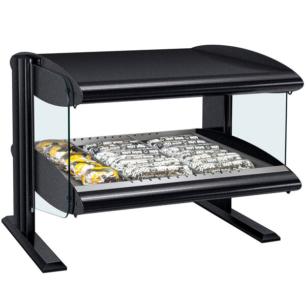 A black Hatco countertop display case with food on a shelf.