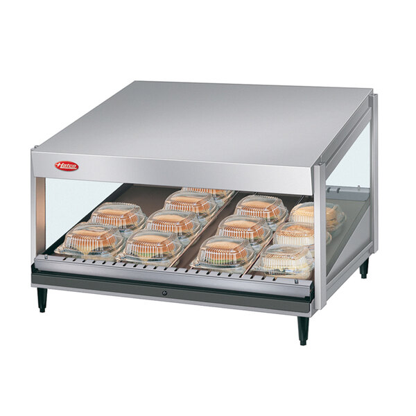 A stainless steel Hatco countertop food warmer with trays of food.