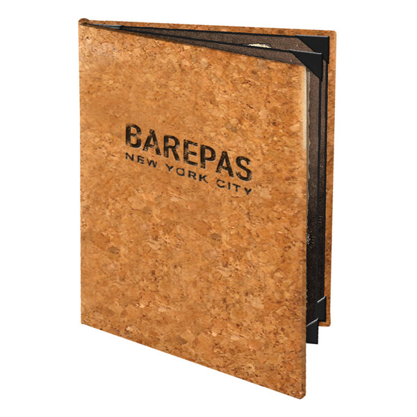 A Menu Solutions natural cork menu cover with black text on a brown cork board.