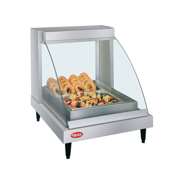 A Hatco Glo-Ray countertop food warmer with pretzels on a shelf inside.