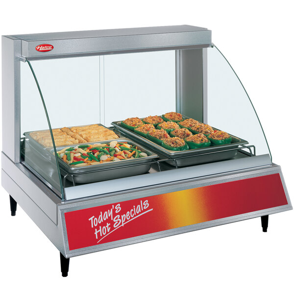 A Hatco Glo-Ray merchandiser with a tray of stuffed peppers inside.