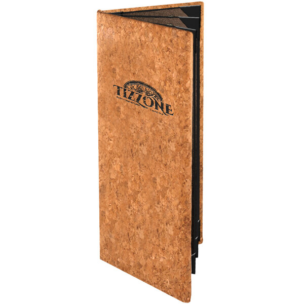 A cork menu cover with a black logo on it.