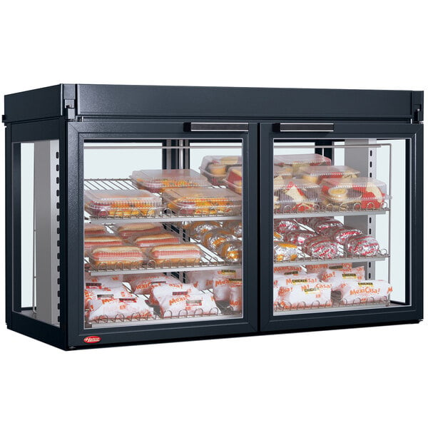 A Hatco Flav-R-Savor merchandising cabinet with food in it.