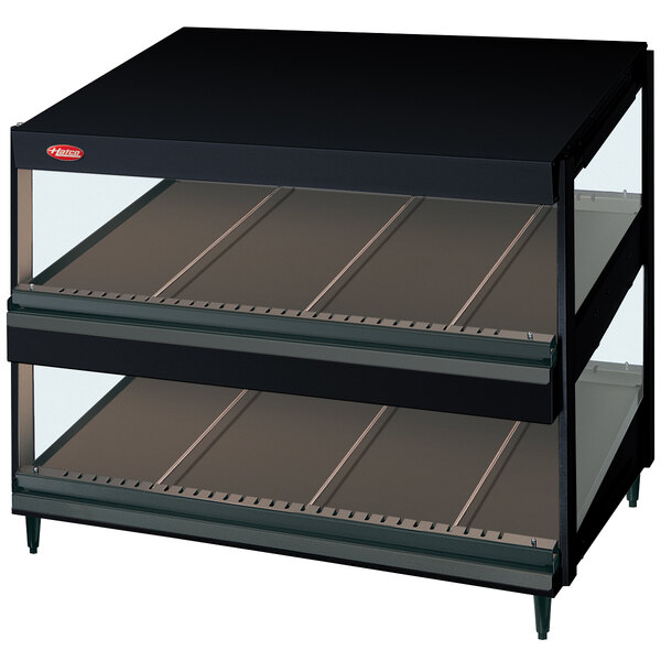 A black rectangular Hatco countertop display case with two glass shelves.
