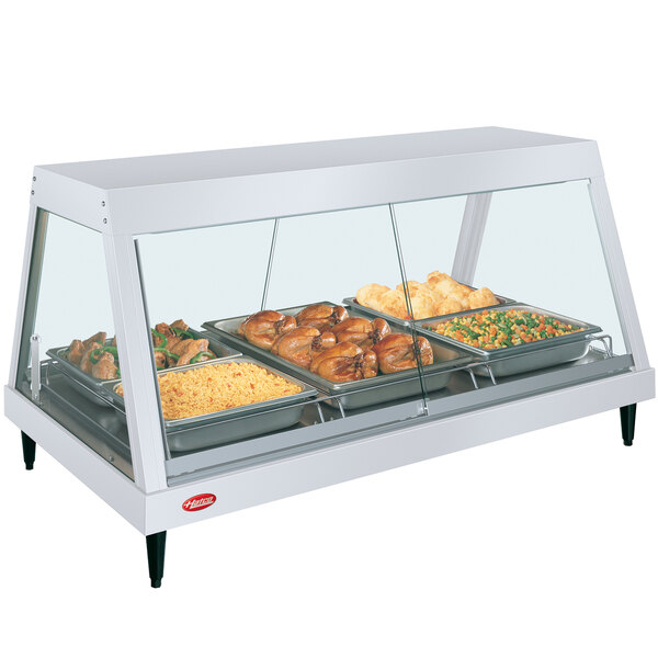 A Hatco countertop display case with a pan of food and vegetables in it.
