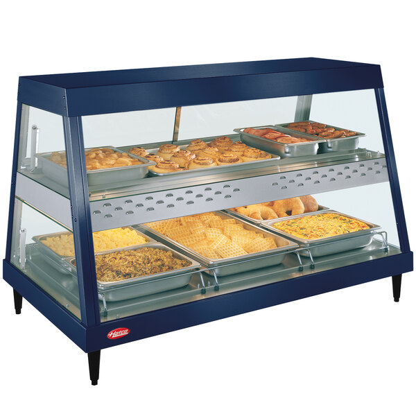 A navy blue stainless steel Hatco countertop food warmer display case with trays of food.