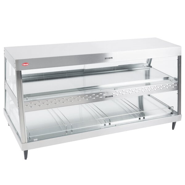 A stainless steel Hatco countertop display warmer with two glass shelves.