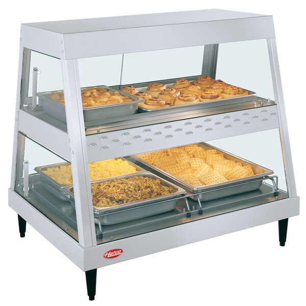 A white Hatco countertop food display case with food on shelves.