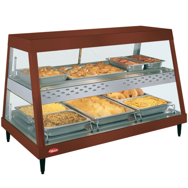 A Hatco countertop dual shelf food display with food in it.