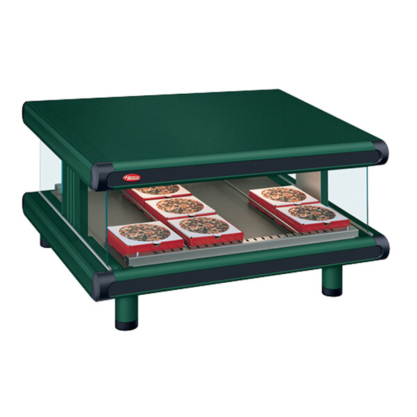 A Hatco Hunter Green countertop with pizza on it.