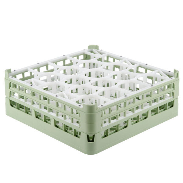 A white and green plastic Vollrath lemon drop glass rack with several small compartments.
