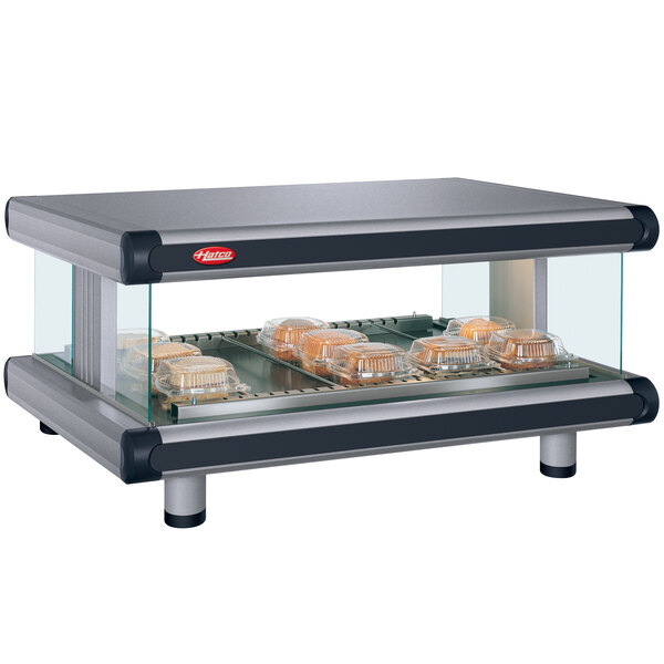A Hatco countertop hot food display warmer with trays of food on it.