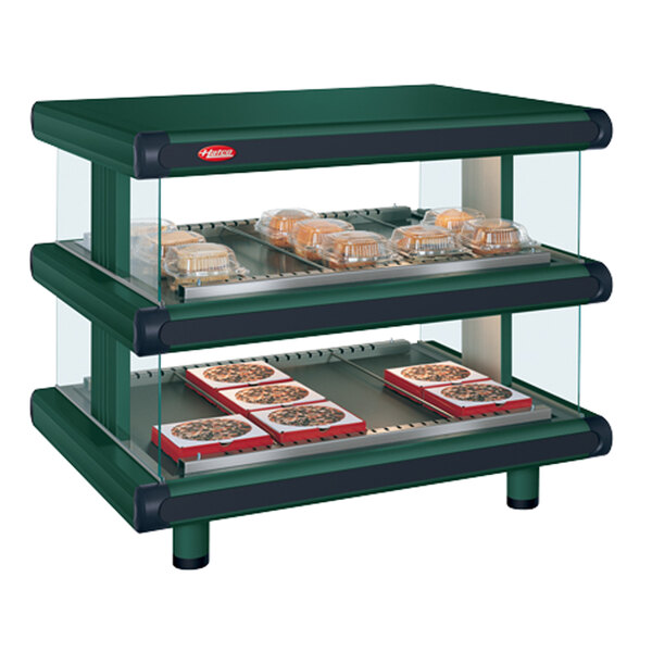 A Hunter Green Hatco countertop double shelf food warmer with food displayed inside.