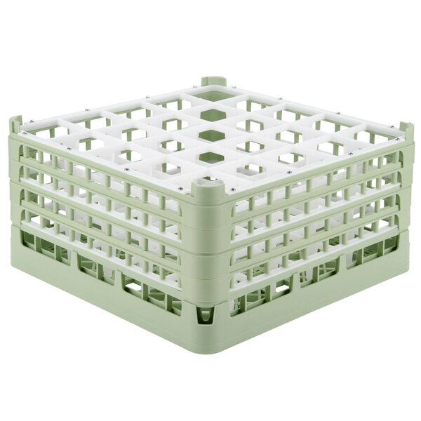 A light green plastic Vollrath glass rack with 25 compartments.