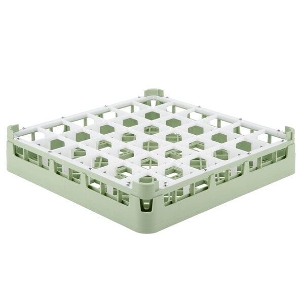 A light green Vollrath glass rack with white compartments.