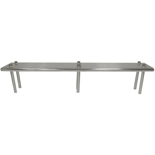A stainless steel table mounted shelving unit above a long table.