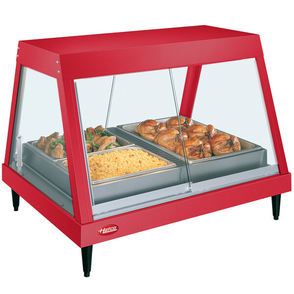 A red Hatco countertop display case with food on a tray.