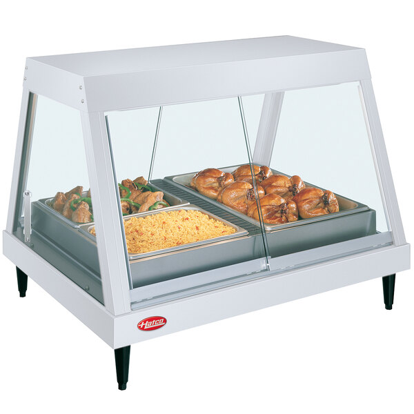 A white Hatco countertop display case with food trays inside.