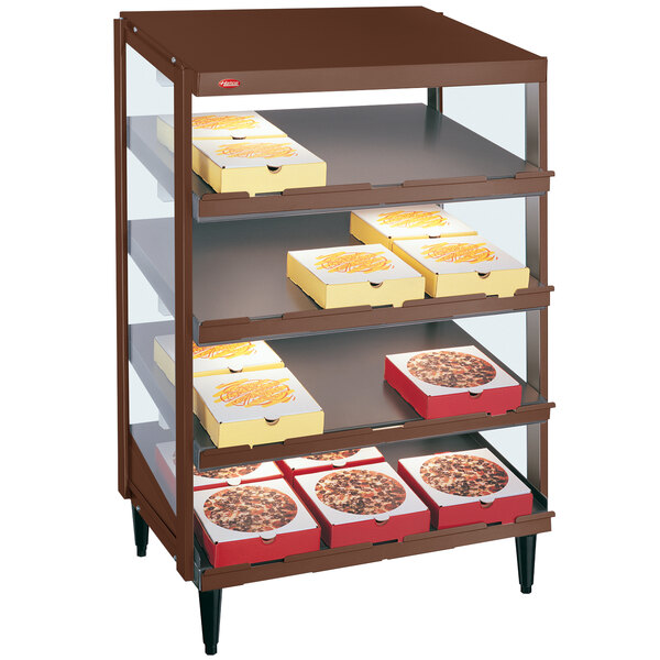 A Hatco countertop pizza warmer with trays of pizza on the shelves.