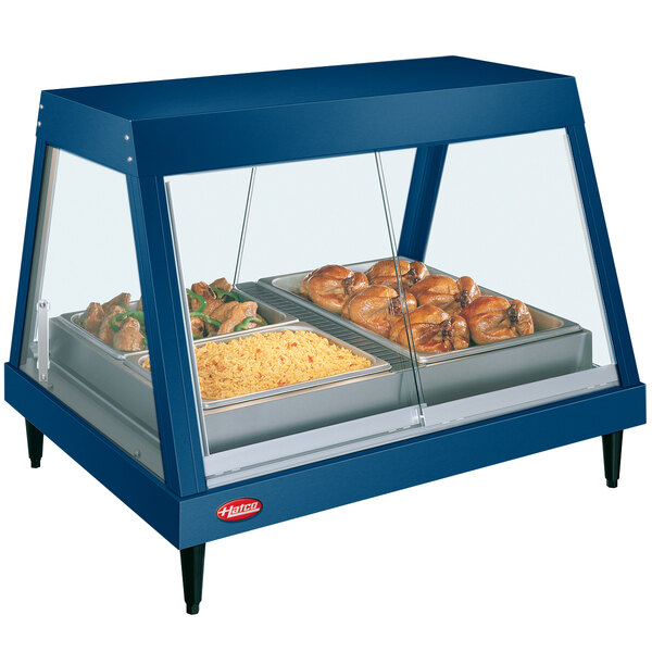 A blue Hatco countertop display case with food on a tray.