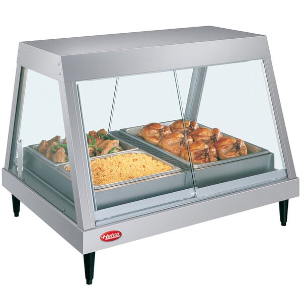 A Hatco stainless steel countertop food display warmer with food in a pan.