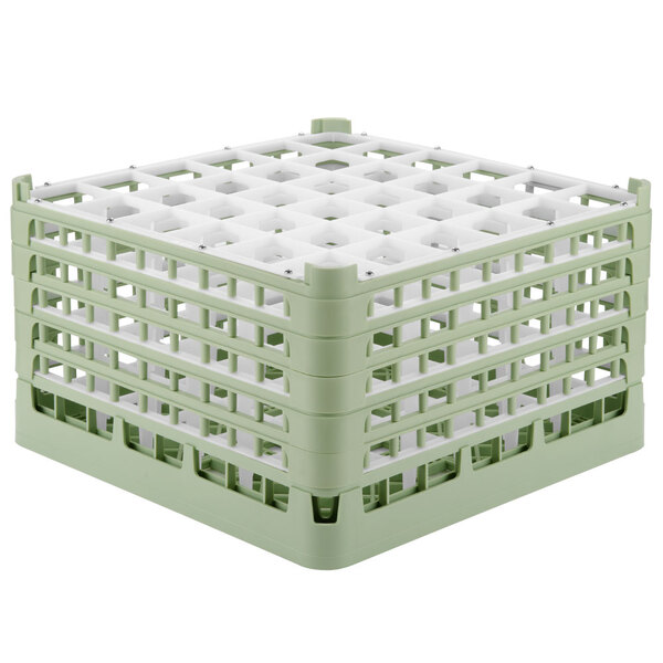 A light green plastic Vollrath glass rack with 36 white compartments.
