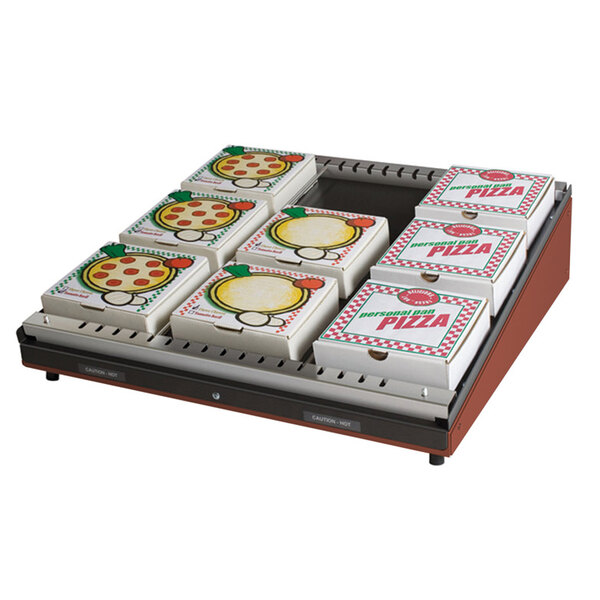 A Hatco countertop pizza warmer with a single shelf and pizza boxes inside.