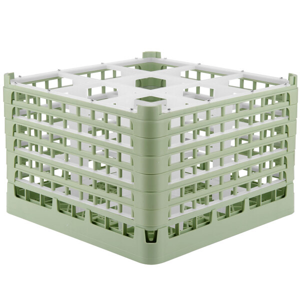 A light green Vollrath plastic glass rack with nine compartments.