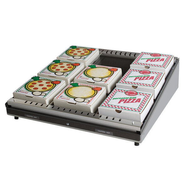 A white Hatco pizza warmer with a single shelf holding several pizza boxes with images on them.