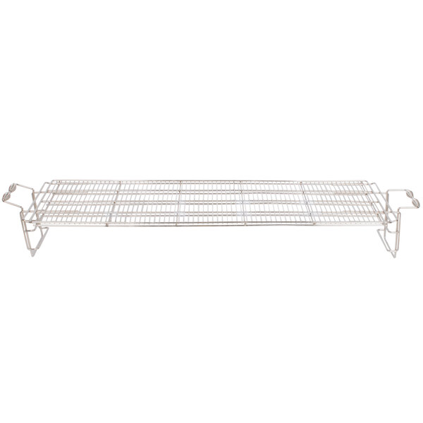 A metal grill grate for a Crown Verity outdoor charbroiler with handles.