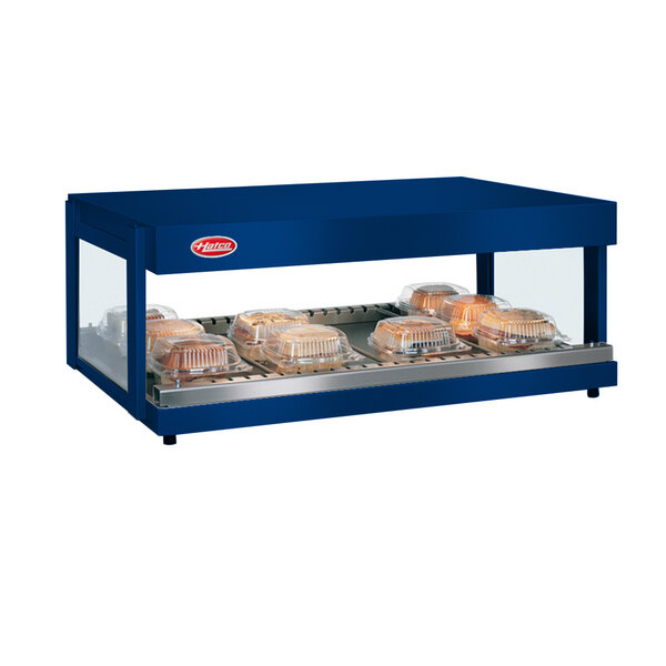 A navy blue Hatco countertop food warmer with a tray of food inside.
