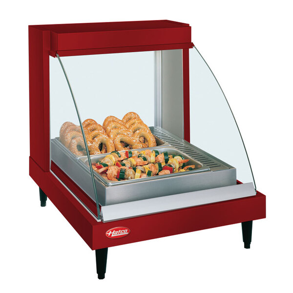A red Hatco countertop food warmer with a tray of food on display.