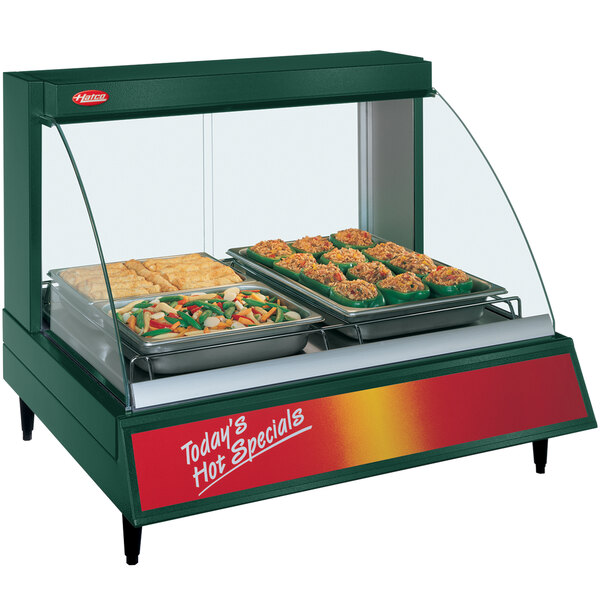 A Hatco countertop food display warmer with a tray of stuffed peppers.