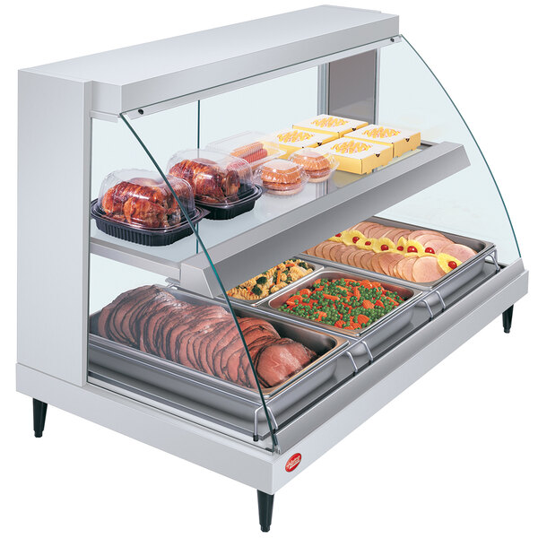 A white Hatco countertop display case with food on two shelves.