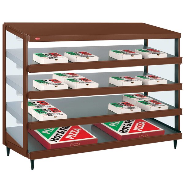 A brown and white Hatco countertop display case with pizza boxes inside.