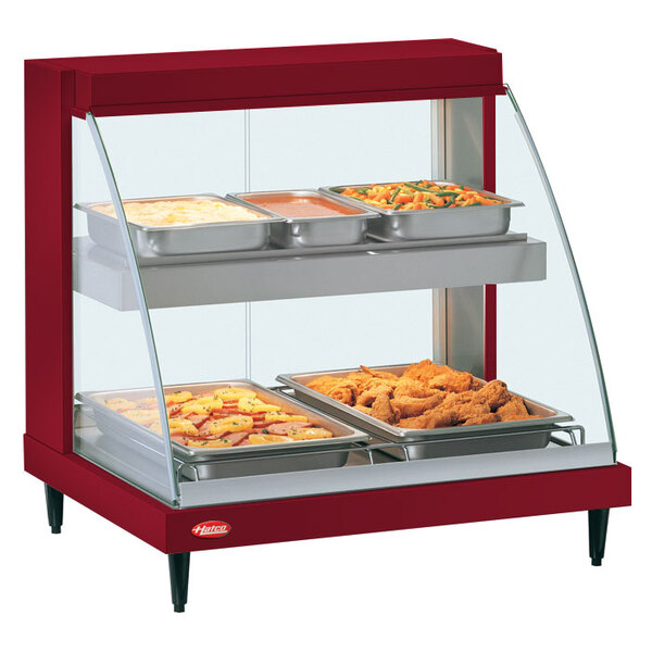 A red Hatco Glo-Ray food warmer display case with trays of food.