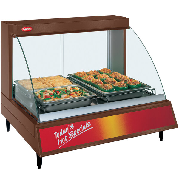 A Hatco countertop food warmer with a single shelf holding two trays of food.