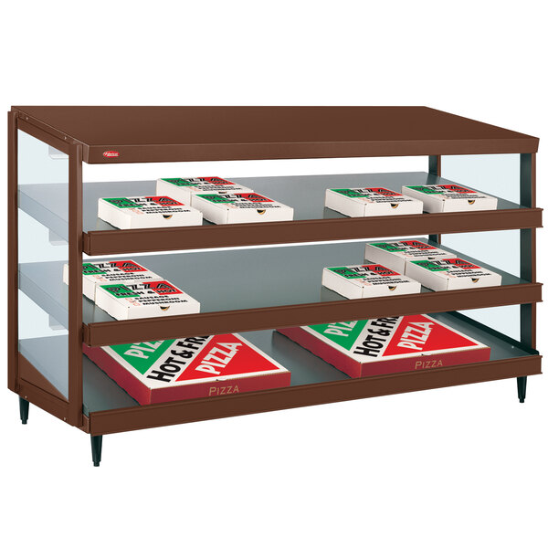 A Hatco countertop pizza warmer with shelves holding pizza boxes.