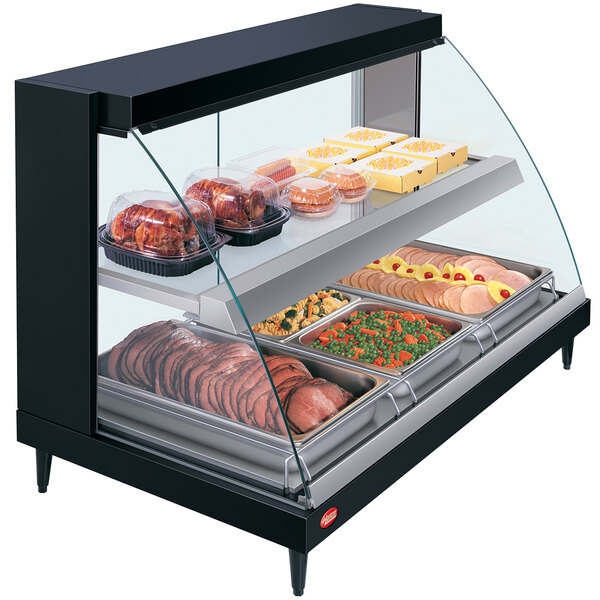 A Hatco Glo-Ray double shelf countertop hot food display warmer with food on shelves.