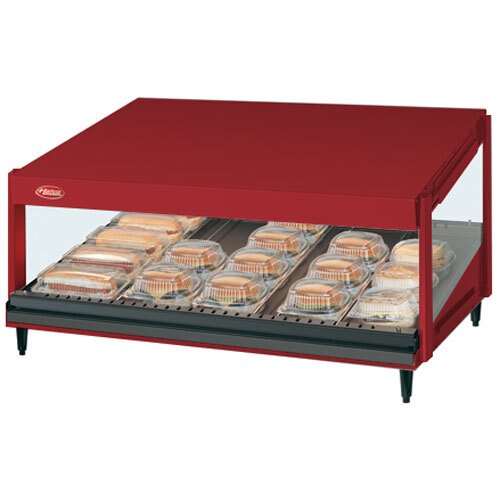 A red Hatco countertop food warmer with food on a shelf.