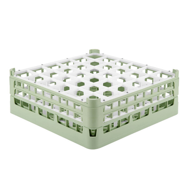 A light green plastic Vollrath glass rack with white compartments.