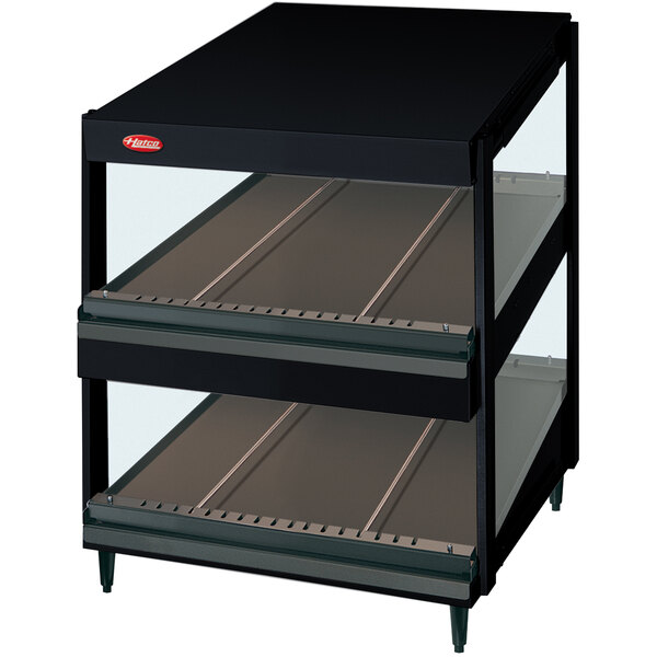 A black Hatco countertop display case with glass shelves.