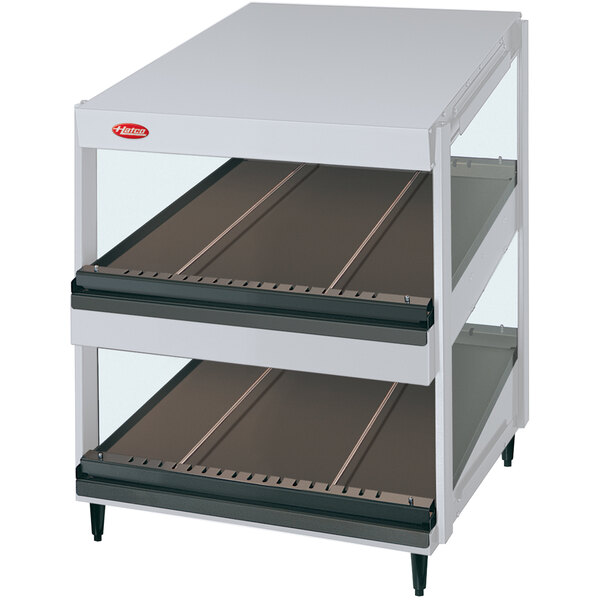 A white granite cart with slanted shelves.