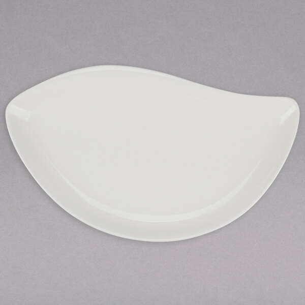 A Tuxton AlumaTux white china leaf platter.