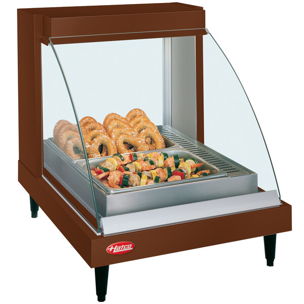 A Hatco countertop food display case with a tray of food.