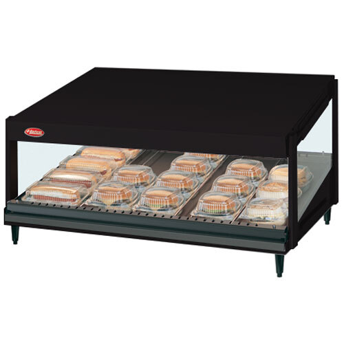 A black Hatco countertop display case with a slanted shelf of food.