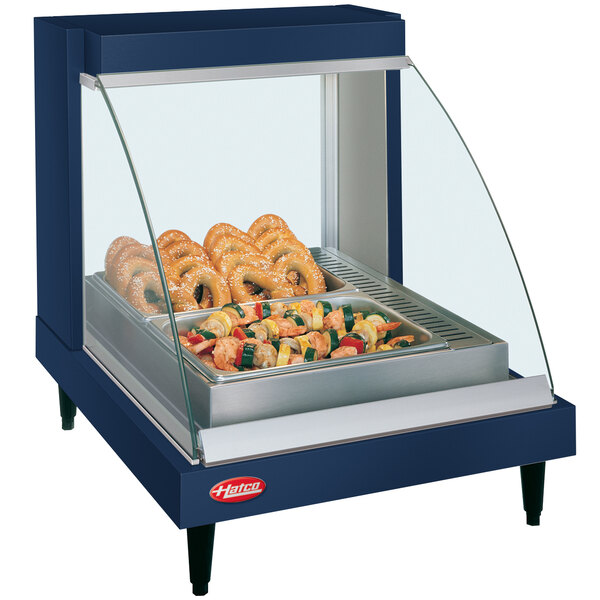 A Hatco countertop food warmer with a tray of food inside.
