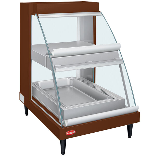 A Hatco countertop display case with glass shelves and a glass door.