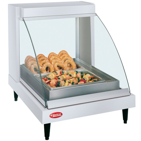 A Hatco Glo-Ray countertop food warmer with food on a tray inside.