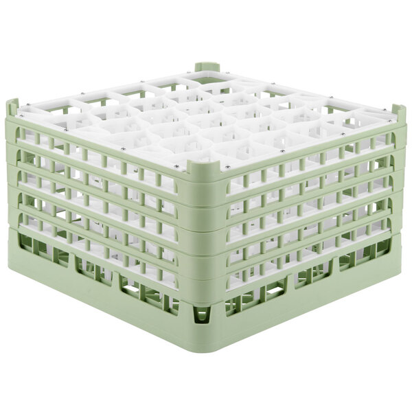A white and green Vollrath Signature plastic glass rack with several compartments.